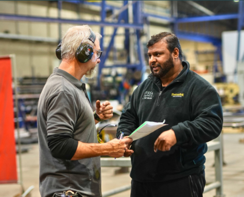 two engineeers talking to eachother at ITSS Engineering