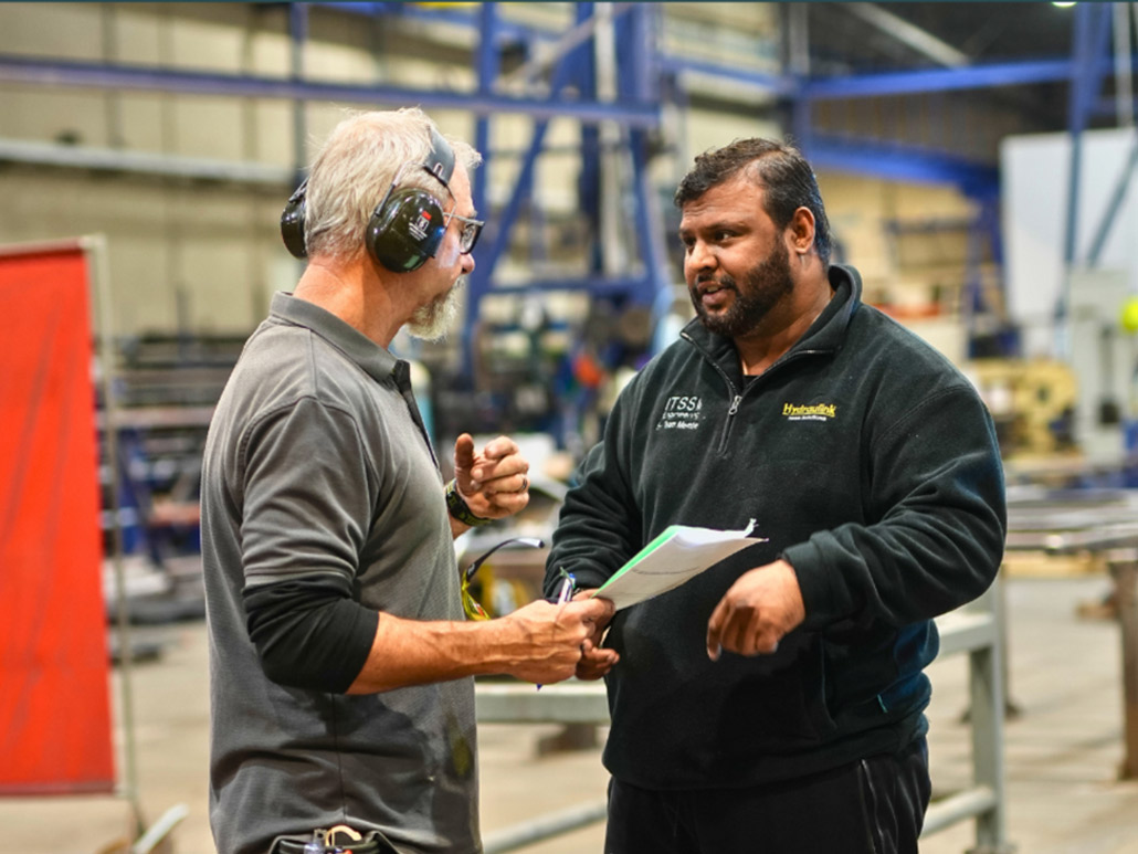 two engineeers talking to eachother at ITSS Engineering
