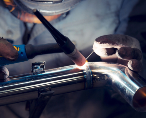 a worker welding stainless steel