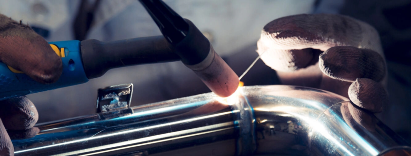 a worker welding stainless steel